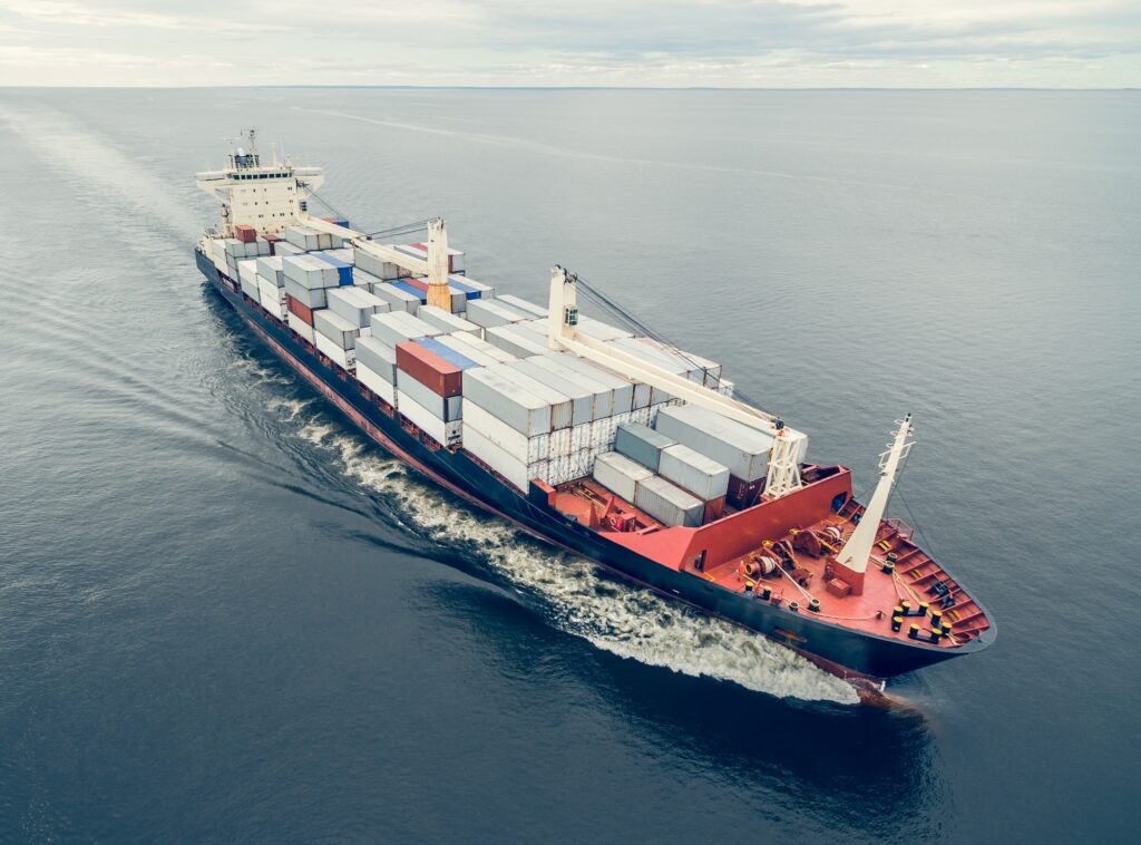 Container ship sailing in open sea